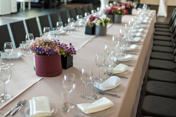 istock a long table served with dishes and flowers. horizontal frame 1227648902