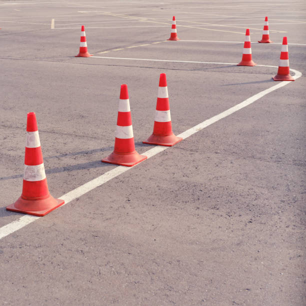istock Orange traffic cones on a site in a driving school and parallel parking 1227649707