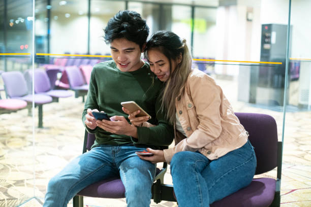 istock Couple checking itinerary at the airport 1227651580