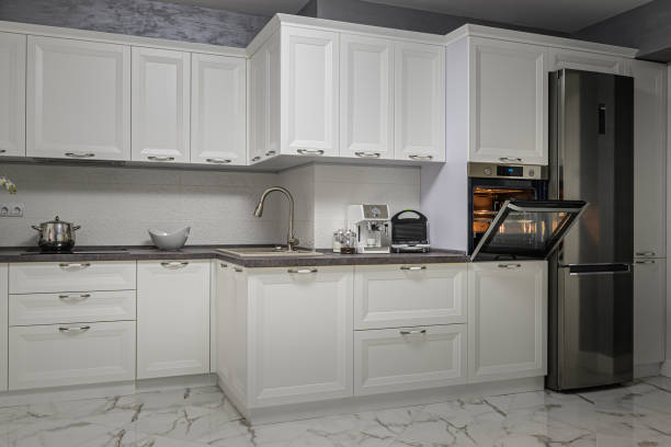 istock Electric appliances in minimalistic white kitchen interior 1227734587
