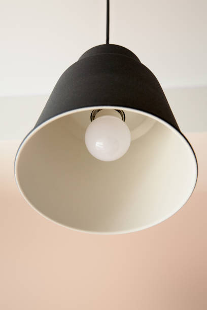 istock low angle view of modern lamp with light bulb 1227853959