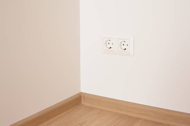 istock modern power plugs on white wall in apartment 1227854474