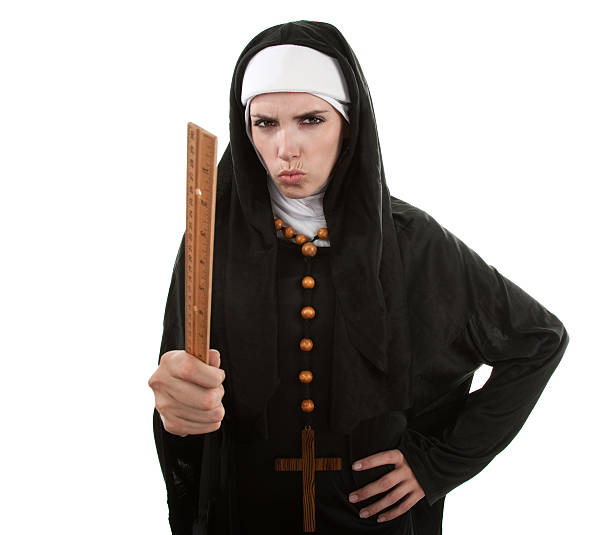 The Angry Nun Angry Young Catholic nun pointing with a ruler angry nun stock pictures, royalty-free photos & images