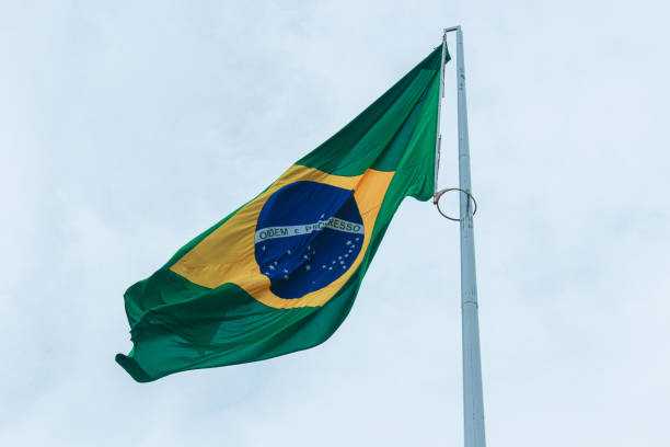 Flag of Brazil hoisted stock photo