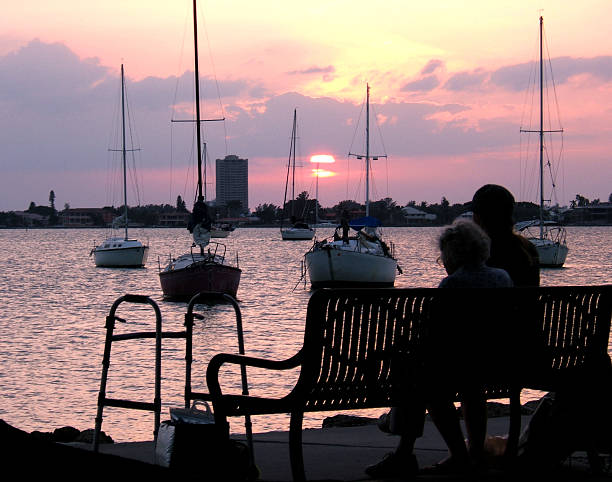 Elderly Couple Watching the Sunset stock photo