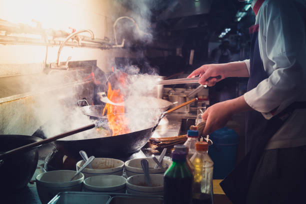 istock Chef stir fry cooking 1228074247