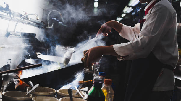 istock Chef stir fry cooking 1228074492