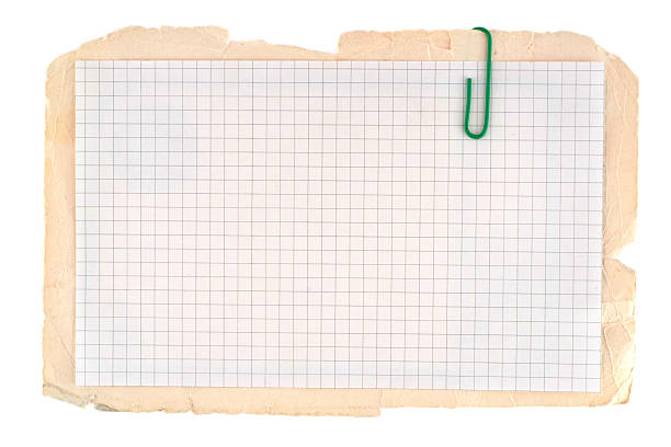 istock Checked notebook paper on the old grungy cardboard background 122810336