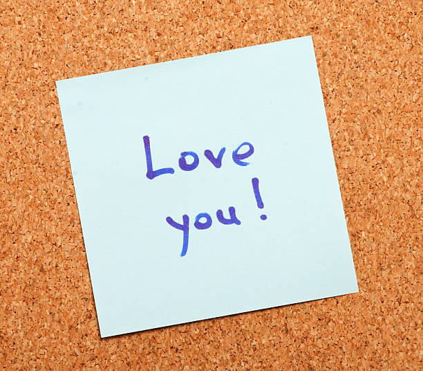 istock Love confession on a note paper pinned to cork board 122814638