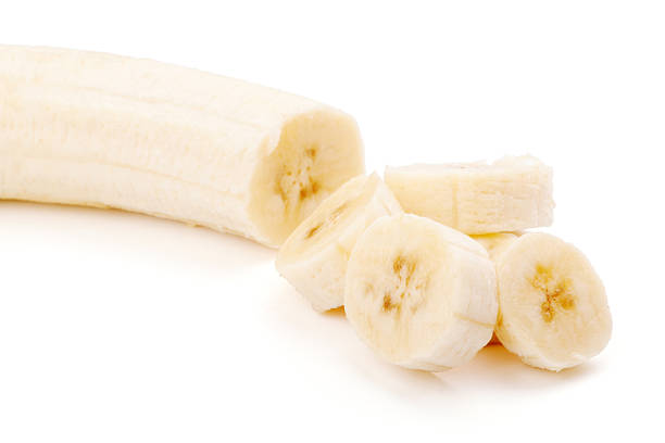 istock Freshly sliced bananas on a white background 122815289
