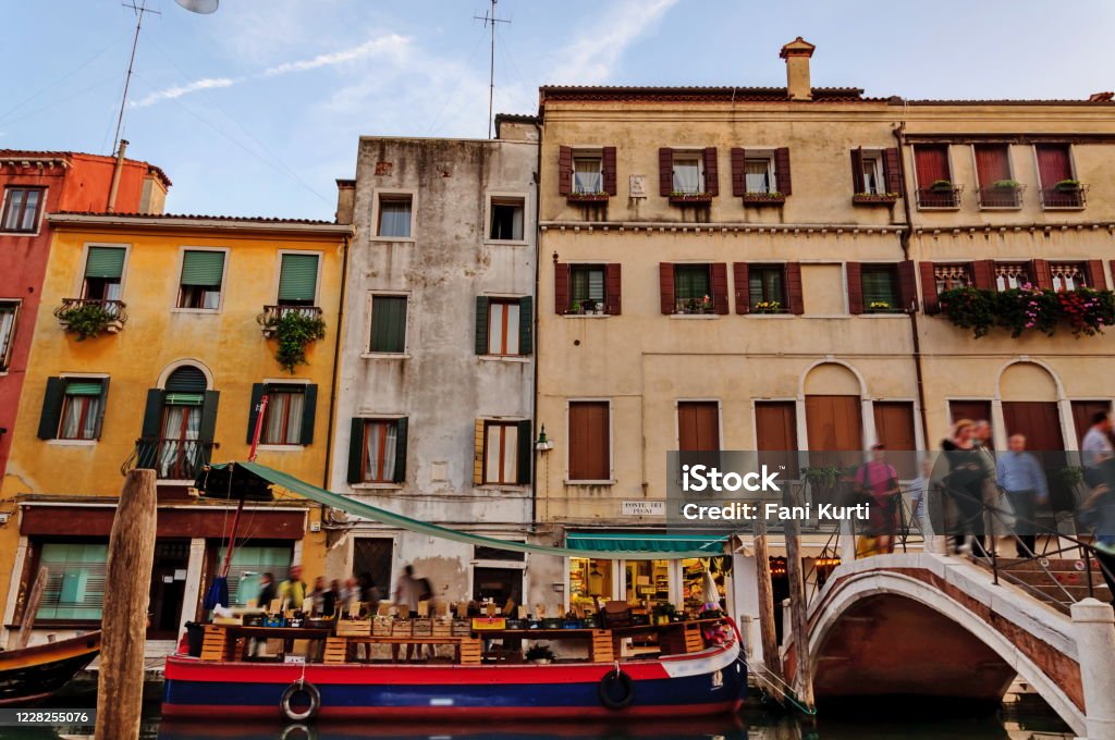 Fruits and veggies market on a boat in Venice italy Venice - Italy Stock Photo