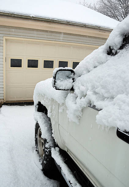 istock Snow covered car  in driveway. 122831224