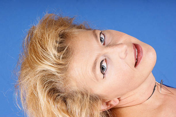 Goofy young woman making a grimace.