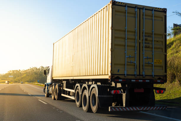 truck transporting container on the road - personal land vehicle imagens e fotografias de stock