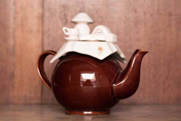 istock Teapot on a wooden stand 1228473000