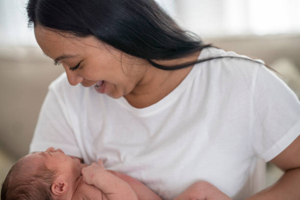 istock New mother holding her daughter closely and showing affection 1228577922