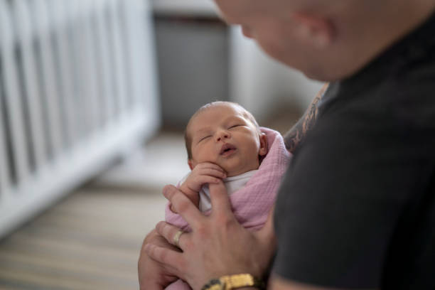 istock New father holding his daughter 1228578202