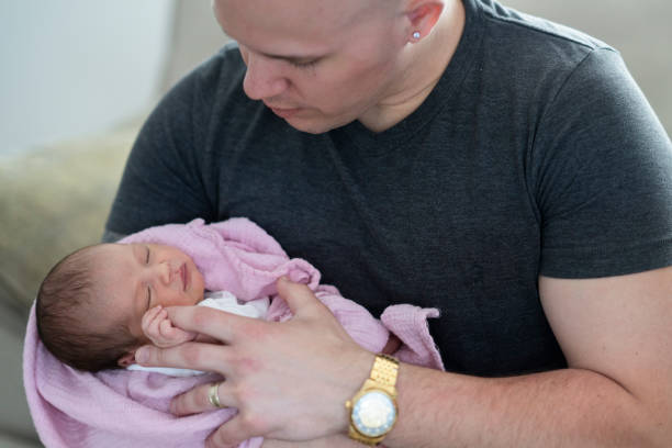 istock New father holding his daughter 1228578963