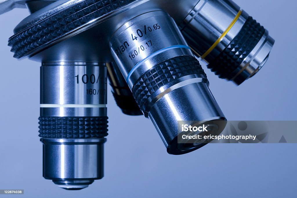 Microscope Turret Labeled Microscope Turret On Blue Background Stock Photo - Download Image Now ...