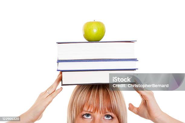 Female Student With Books On Her Head Stock Photo - Download Image Now - 20-24 Years, 25-29 Years, Adult
