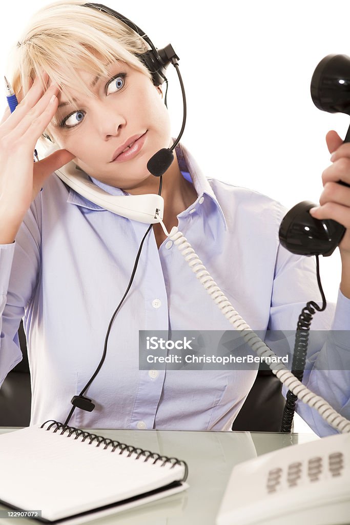 Occupato Receptionist - Foto stock royalty-free di 20-24 anni