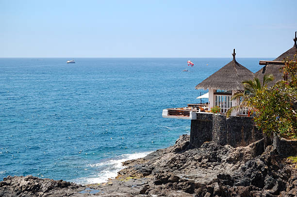 istock Open-air restaurant with view on Atlantic Ocean, Tenerife island, Spain 122908496