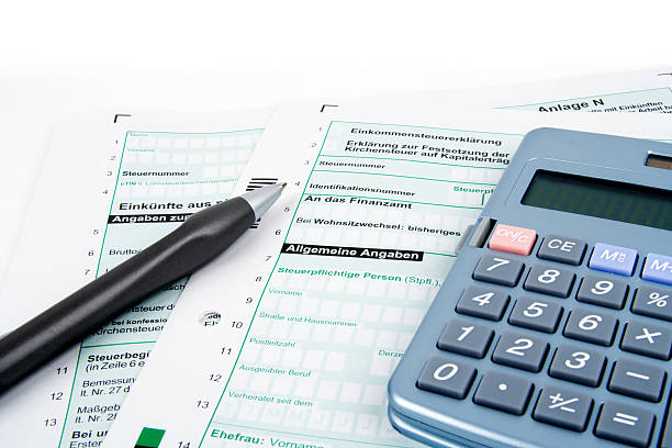 istock German tax forms, pen and calculator - copy space 122910091