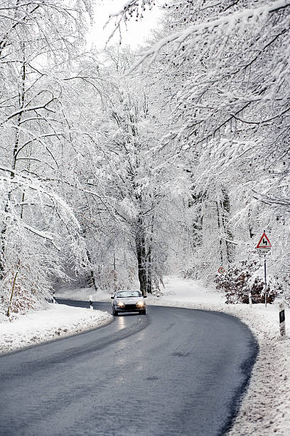 istock Road with car in winter forest - hoar frost 122912342