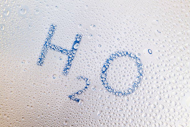 H2O Refraction in water drops stock photo