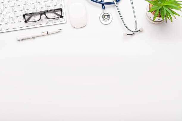 istock Top view with working desk with laptop,cellphone,notebook pencil coffee cup and eyeglasses in the office. 1229370302