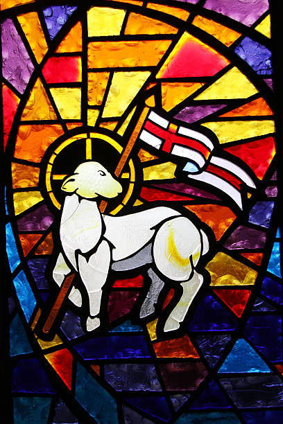 Stained glass window found in a very old church depicting the Lamb of God.