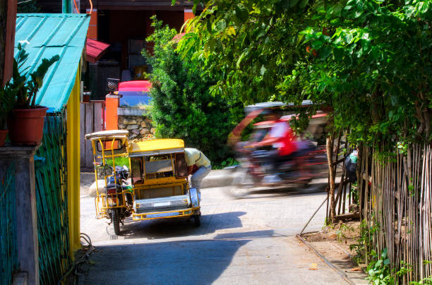 istock Typical Tricycle Traffic in Puerto Galera on Mindoro, Philippines 1229529058