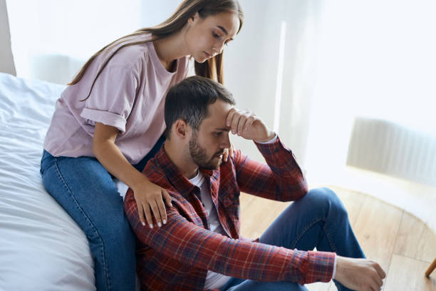 istock Young wife supporting upset husband 1229703815