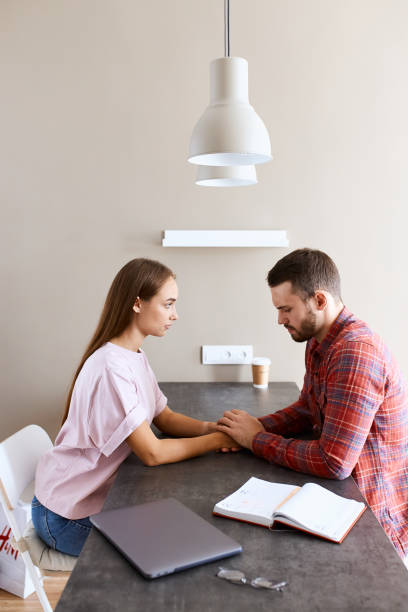 istock Upset couple sitting at table 1229715376