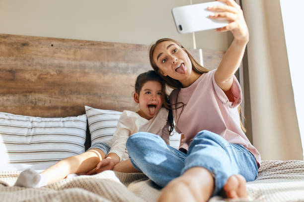 istock Child girl playing with young mom 1229721710