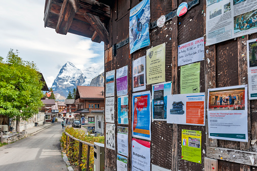 Lauterbrunnen, Switzerland - October 2019: Wooden notice board at Murren mountain village situated in the Bernese Highlands in Switzerland