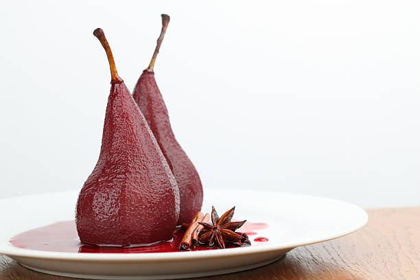 Poached pears in red wine stock photo