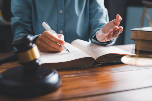 istock Lawyers give advice about judgment, agreements, justice Customer 1229821900