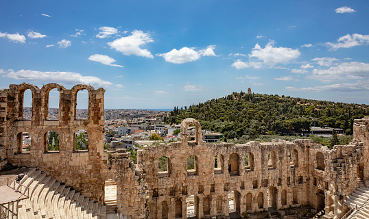 Herodes Atticus Odeon, Herodium ancient theater under the ruins of Acropolis, Greece, overlooking Athens city, sunny spring day, blue sky