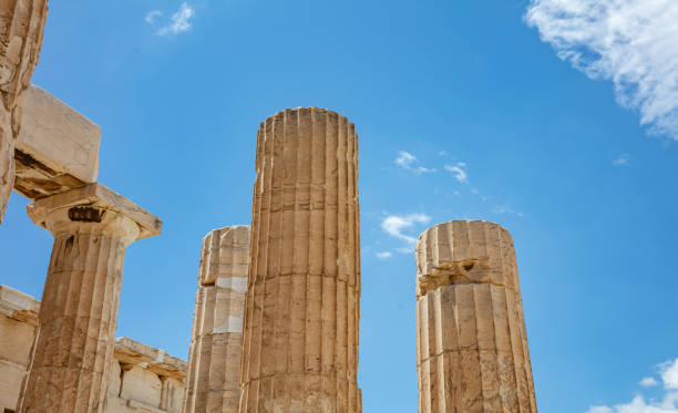 istock Athens, Greece. Propylaea columns in the Acropolis, blue cloudy sky in spring sunny day. 1229874221