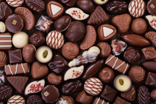 istock mix chocolate candy, sweet snack, food background. 1229972865
