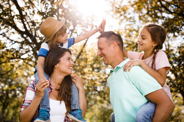 istock Carefree parents and their small kids having fun in springtime. 1229989578