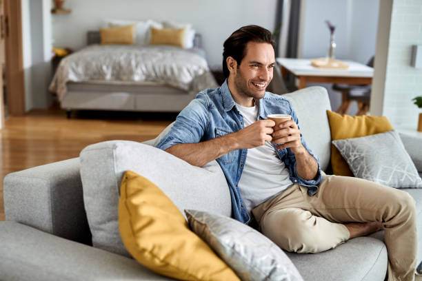 istock Happy man enjoying in his coffee time at home. 1229993097