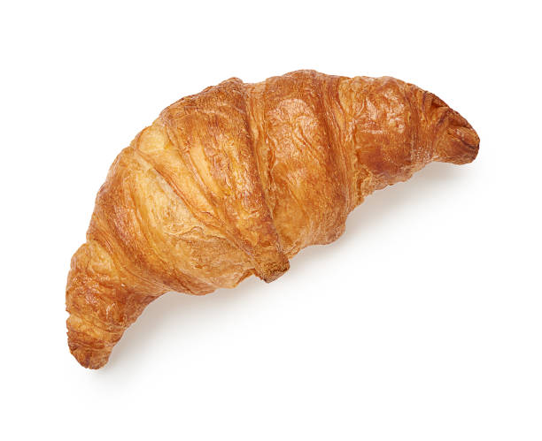 Fresh croissant isolated on white background. Top view. stock photo