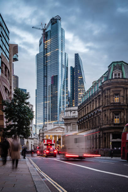 istock Evening illumination in London city during rush hour - creative stock image 1230037758