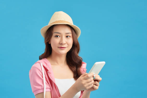 istock Attractive girl having smart phone in hands, checking email, using 5G internet, typing sms 1230060184