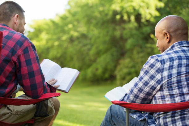 istock Multi-Ethnic group of friends talking and having a bible study. 1230086082
