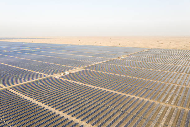 istock Photovoltaic solar panel farm in a desert. 1230089111