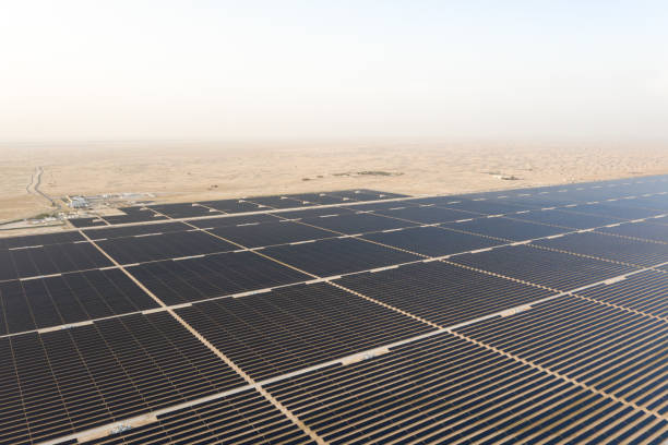 istock Photovoltaic solar panel farm in a desert. 1230089495