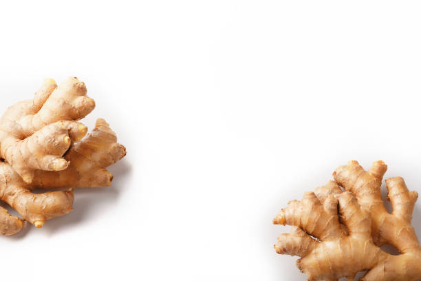 istock Fresh ginger root on a white background on the edges of the frame, isolate 1230125160